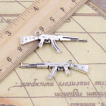 Металлическая подвеска пулемёт AK-47  цвет серебро 1 шт  7730